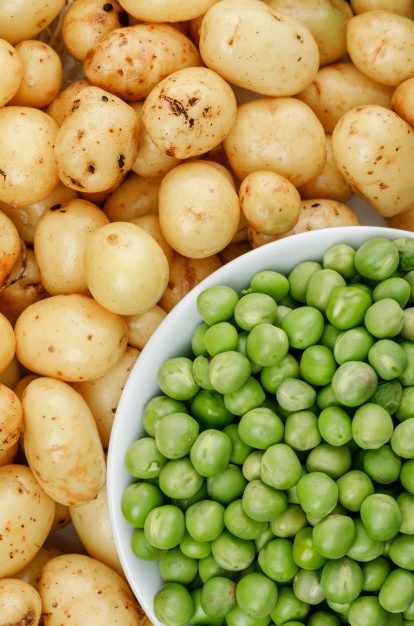 green-peas-white-bowl-potatoes-wall-close-up_176474-5711